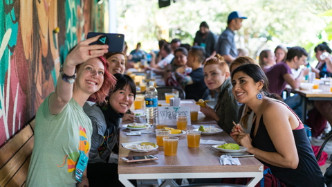 7in7 Year Three attendees eating lunch in Medellín